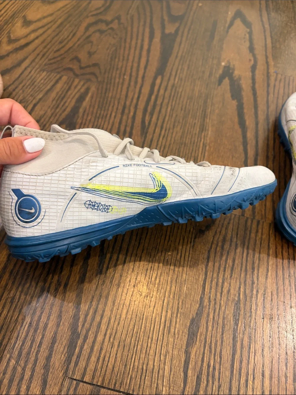 Nike Kids White High-Top Turf Sneakers with Blue and Neon Yellow Accents